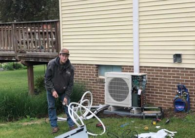 Ac Tech Working On Ac Side Of House